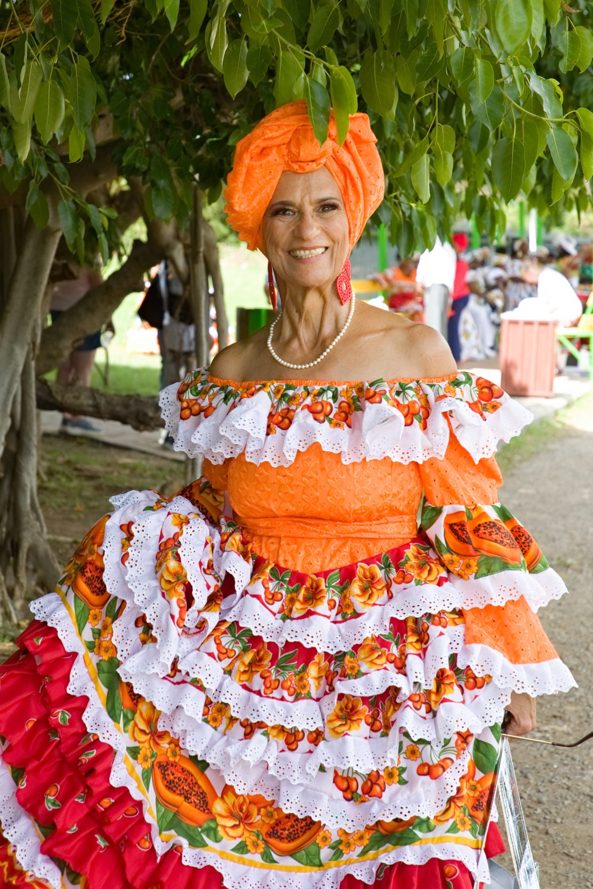 An elder wearing traditional Sint Maarten dress and head wrap